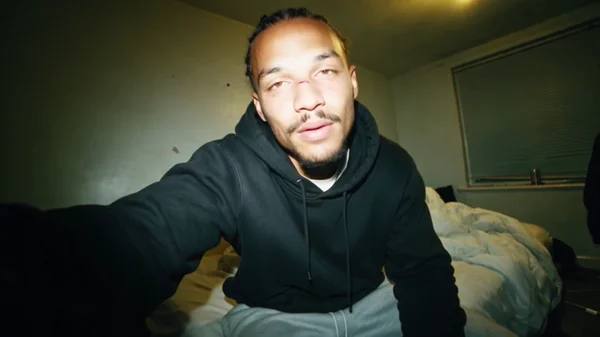 Home recorded rap performance cut across five phone clips