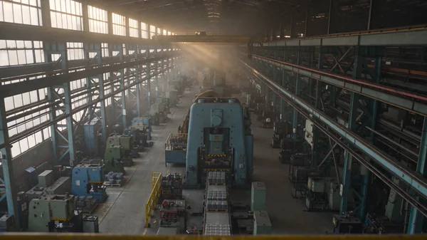 Metal fabrication press line across five documentary shots